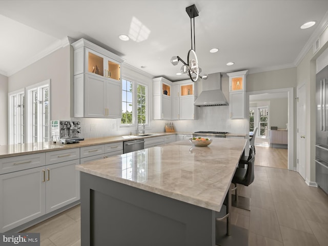 720 Cyprian Ct, Gambrills, MD 21054 - kitchen with wall chimney range hood, crown molding, stainless steel dishwasher, a sink, and light stone counters