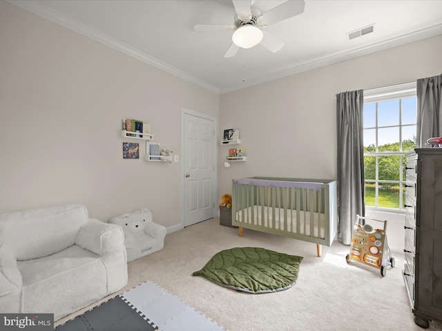720 Cyprian Ct, Gambrills, MD 21054 - bedroom with carpet flooring, crown molding, a crib, ceiling fan, and baseboards