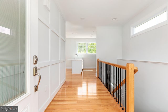 134 Stony Pointe Way, Strasburg, VA 22657 - hall with light wood-type flooring, an upstairs landing, recessed lighting, a sink, and baseboards