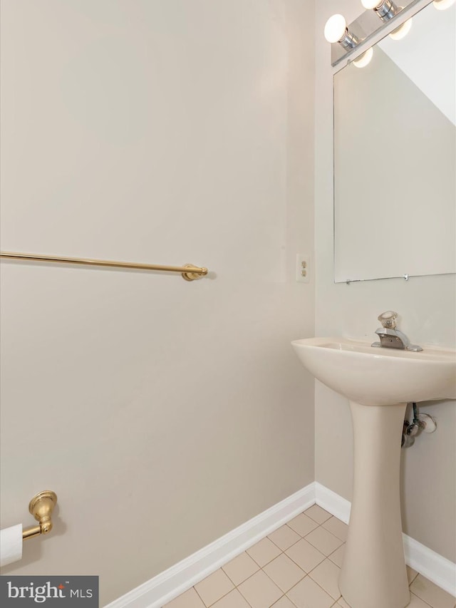 bathroom featuring tile patterned flooring and baseboards