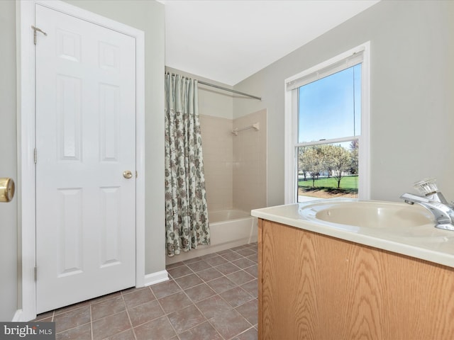 bathroom featuring tile patterned floors, shower / bath combination with curtain, and vanity