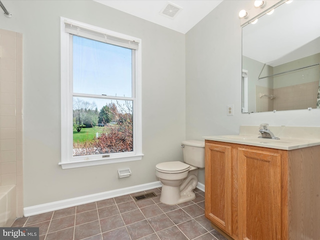 full bathroom featuring toilet, baseboards, tile patterned floors, vanity, and shower / washtub combination