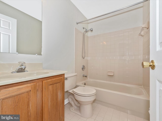 bathroom with tile patterned floors, toilet, vanity, and shower / bathtub combination