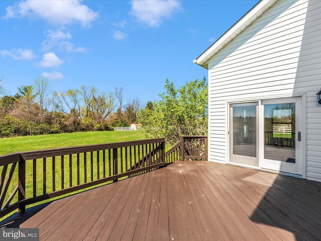 wooden deck with a yard