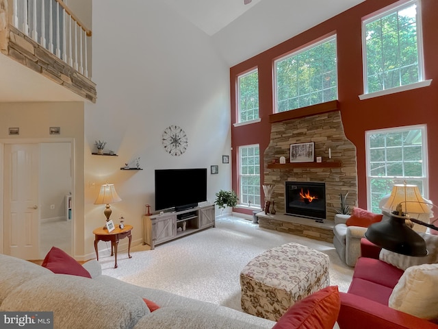 9150 Sparkling Pl, Charlotte Hall, MD 20622 - carpeted living room featuring high vaulted ceiling, a fireplace, and baseboards