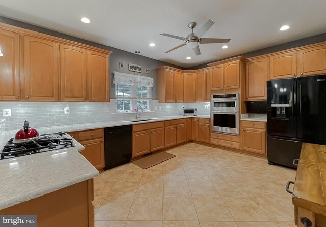 9150 Sparkling Pl, Charlotte Hall, MD 20622 - kitchen featuring black appliances, a sink, ceiling fan, backsplash, and light tile patterned floors