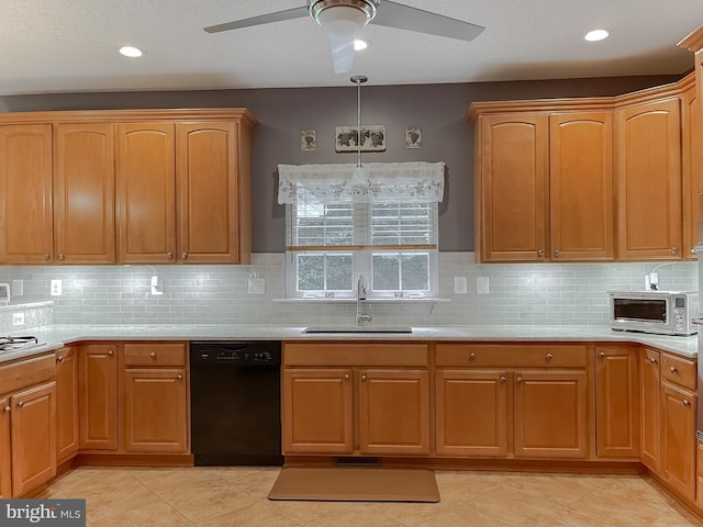 9150 Sparkling Pl, Charlotte Hall, MD 20622 - kitchen with black dishwasher, a sink, ceiling fan, light countertops, and recessed lighting