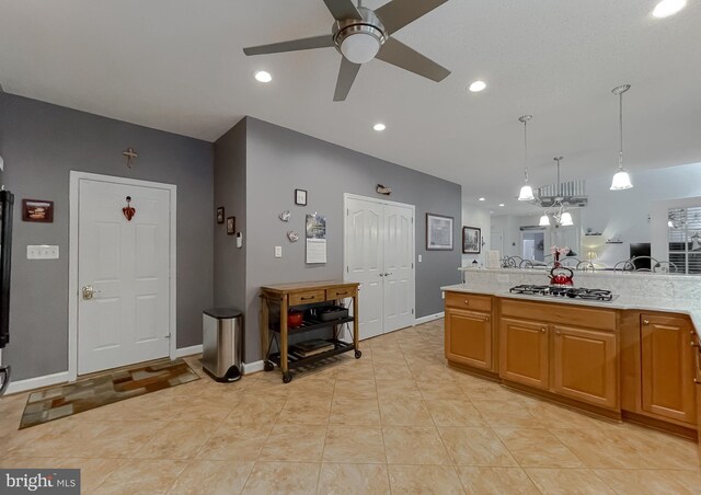 9150 Sparkling Pl, Charlotte Hall, MD 20622 - kitchen featuring stainless steel gas stovetop, a ceiling fan, light countertops, decorative light fixtures, and recessed lighting