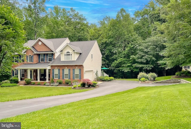 9150 Sparkling Pl, Charlotte Hall, MD 20622 - view of front of property featuring brick siding, driveway, an attached garage, and a front lawn