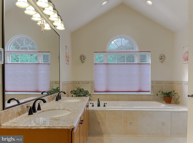 9150 Sparkling Pl, Charlotte Hall, MD 20622 - full bath featuring a bath, double vanity, high vaulted ceiling, and tile patterned flooring