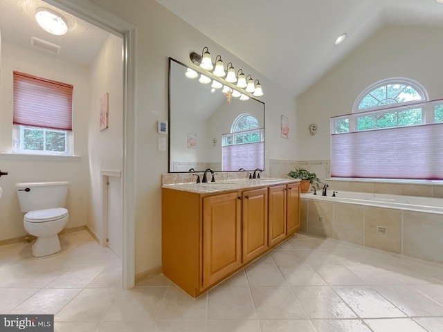 9150 Sparkling Pl, Charlotte Hall, MD 20622 - bathroom featuring healthy amount of natural light, lofted ceiling, tile patterned floors, double vanity, and toilet