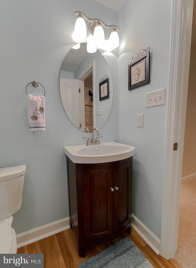 9150 Sparkling Pl, Charlotte Hall, MD 20622 - bathroom featuring toilet, vanity, and baseboards