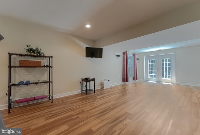 9150 Sparkling Pl, Charlotte Hall, MD 20622 - unfurnished living room with french doors, light wood-style floors, baseboards, and recessed lighting