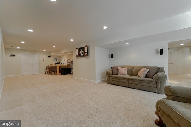 9150 Sparkling Pl, Charlotte Hall, MD 20622 - living room featuring light colored carpet, recessed lighting, baseboards, and bar
