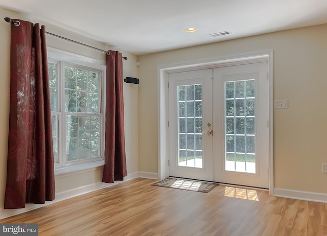 9150 Sparkling Pl, Charlotte Hall, MD 20622 - doorway to outside featuring french doors, healthy amount of natural light, wood finished floors, and recessed lighting