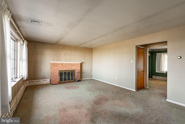 904 W Main St, New Holland, PA 17557 - unfurnished living room featuring baseboard heating, carpet floors, a fireplace, and baseboards