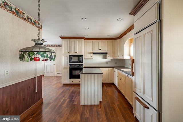 904 W Main St, New Holland, PA 17557 - kitchen featuring black appliances, dark countertops, cream cabinetry, under cabinet range hood, and recessed lighting