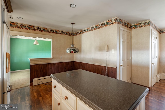 904 W Main St, New Holland, PA 17557 - kitchen with a baseboard radiator, dark countertops, dark wood-type flooring, and wallpapered walls