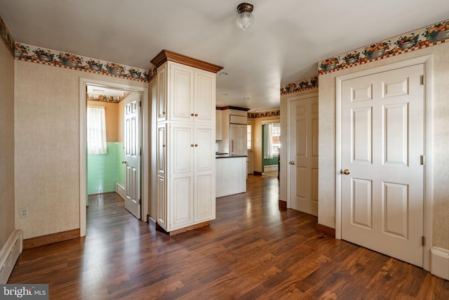 904 W Main St, New Holland, PA 17557 - kitchen with plenty of natural light, dark wood-type flooring, a baseboard heating unit, and dark countertops