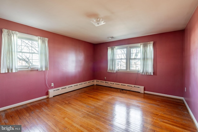 904 W Main St, New Holland, PA 17557 - empty room with hardwood / wood-style flooring, baseboards, and baseboard heating