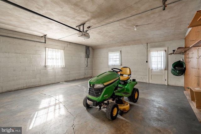 904 W Main St, New Holland, PA 17557 - garage featuring a garage door opener and concrete block wall