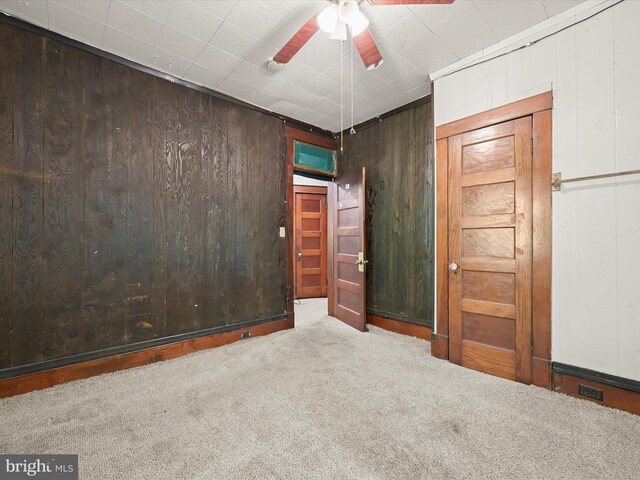 1812 64th Ave, Landover, MD 20785 - spare room featuring carpet, ceiling fan, and wooden walls