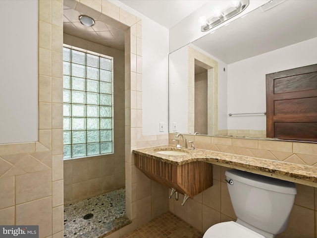1812 64th Ave, Landover, MD 20785 - full bath with a sink, tile walls, toilet, plenty of natural light, and walk in shower