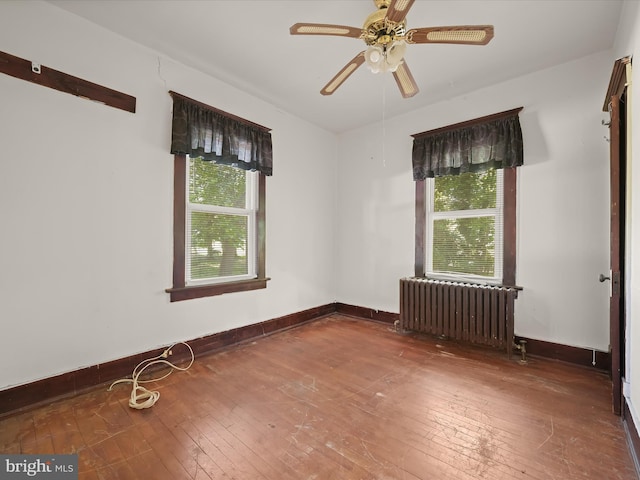 1812 64th Ave, Landover, MD 20785 - unfurnished room featuring radiator, healthy amount of natural light, hardwood / wood-style floors, and ceiling fan