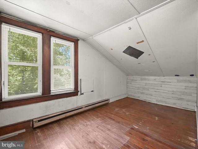1812 64th Ave, Landover, MD 20785 - bonus room featuring a baseboard radiator, hardwood / wood-style flooring, vaulted ceiling, and wooden walls