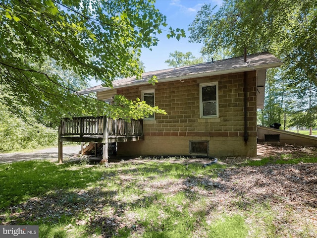 1812 64th Ave, Landover, MD 20785 - view of side of property with a wooden deck and a shingled roof