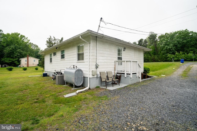 2880 Middletown Rd, Waldorf, MD 20603 - view of home's exterior with oil tank and a lawn