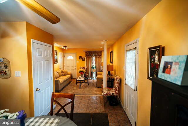 2880 Middletown Rd, Waldorf, MD 20603 - living room featuring dark colored carpet and ornate columns