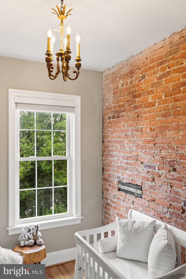 429 Manor Pl NW, Washington, DC 20010 - bedroom featuring a chandelier, multiple windows, wood finished floors, and baseboards