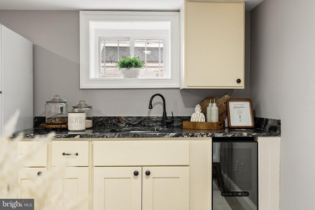 429 Manor Pl NW, Washington, DC 20010 - kitchen with a sink, wine cooler, and dark stone countertops