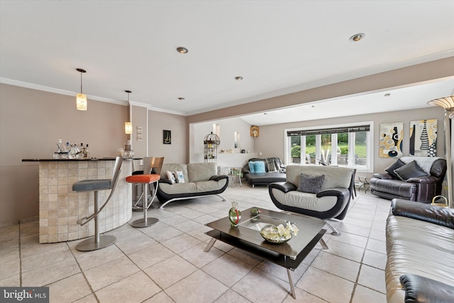 living room featuring light tile patterned flooring, a dry bar, and crown molding