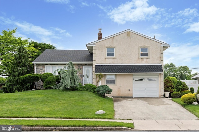 split level home with driveway, a front yard, an attached garage, a chimney, and a shingled roof
