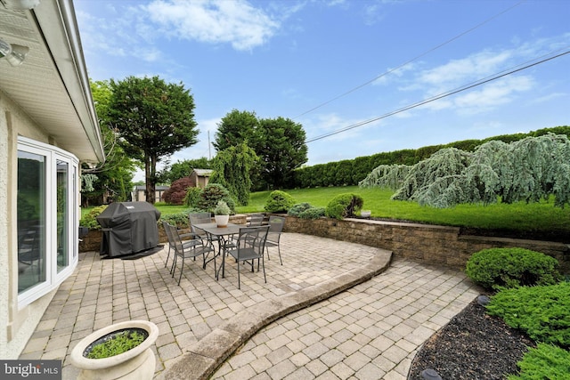 view of patio / terrace featuring area for grilling and outdoor dining space