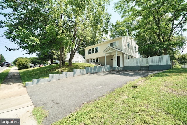 14313 Randall Dr, Woodbridge, VA 22191 - colonial house featuring asphalt driveway and a front lawn