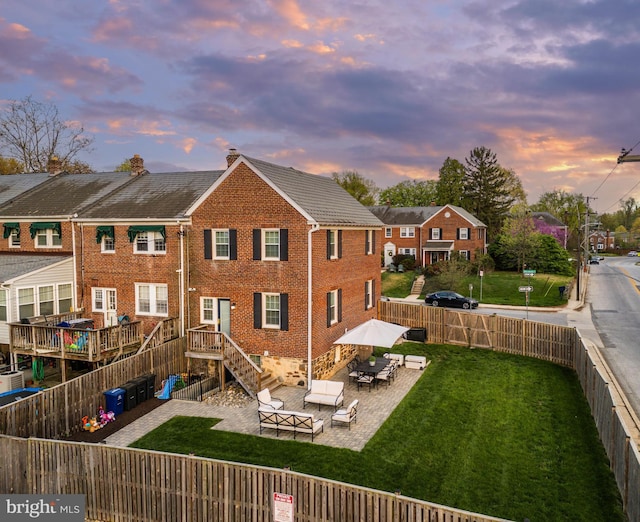2 Murdock Rd, Baltimore, MD 21212 - rear view of house with brick siding and a patio area
