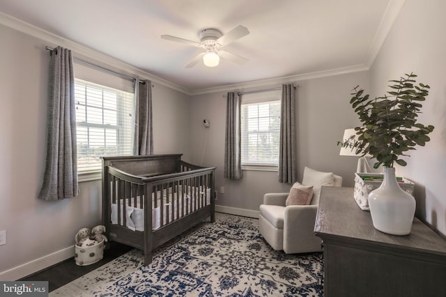 2 Murdock Rd, Baltimore, MD 21212 - bedroom featuring baseboards, a crib, crown molding, wood finished floors, and ceiling fan
