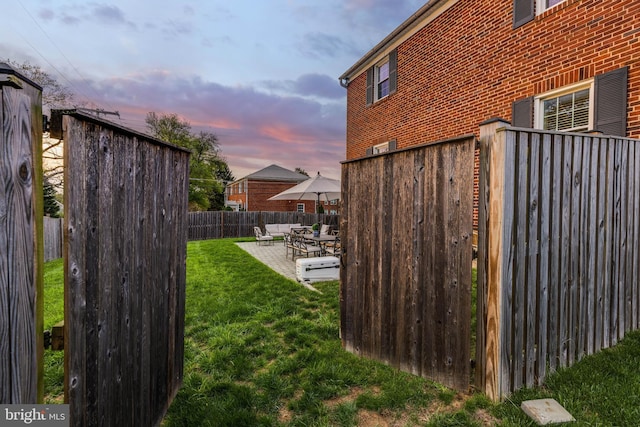 2 Murdock Rd, Baltimore, MD 21212 - yard at dusk featuring a patio