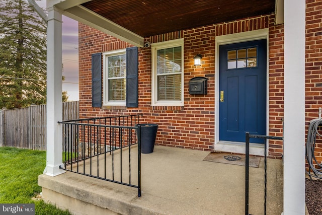 2 Murdock Rd, Baltimore, MD 21212 - doorway to property with brick siding and a porch