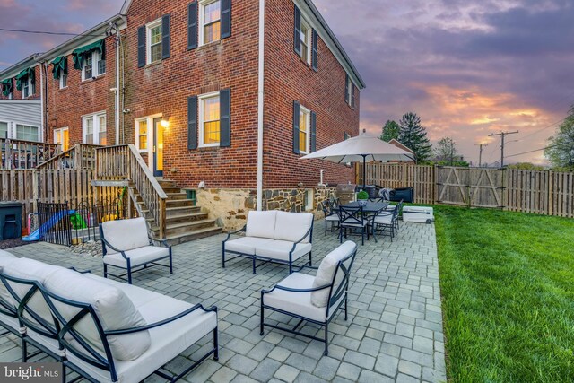 2 Murdock Rd, Baltimore, MD 21212 - patio terrace at dusk with an outdoor hangout area, a patio, stairs, and outdoor dining space