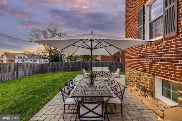 2 Murdock Rd, Baltimore, MD 21212 - patio terrace at dusk featuring a patio, outdoor dining area, and an outdoor living space