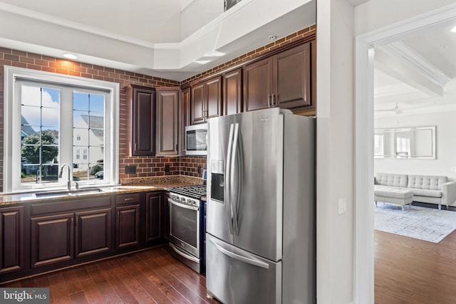 21 Whaleback Ln, Fredericksburg, VA 22406 - kitchen with appliances with stainless steel finishes, a sink, dark wood finished floors, crown molding, and stone counters