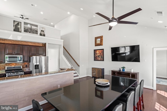 21 Whaleback Ln, Fredericksburg, VA 22406 - dining space with ceiling fan, dark wood-style flooring, recessed lighting, high vaulted ceiling, and stairs