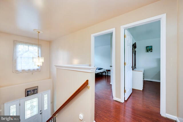 1533 Meadowview Dr, Pottstown, PA 19464 - hall featuring an upstairs landing, a chandelier, dark wood-style floors, and baseboards