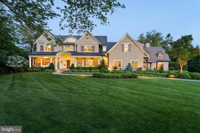 6529 Sothoron Rd, Mclean, VA 22101 - view of front facade featuring a standing seam roof, a front lawn, metal roof, and a chimney
