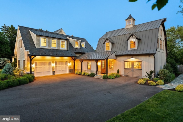 6529 Sothoron Rd, Mclean, VA 22101 - view of front of property with a standing seam roof, driveway, metal roof, and a garage