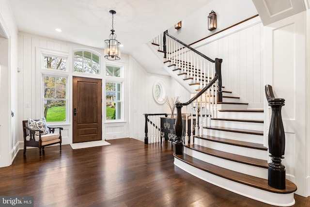 6529 Sothoron Rd, Mclean, VA 22101 - entryway featuring wood finished floors, a decorative wall, stairs, a chandelier, and recessed lighting